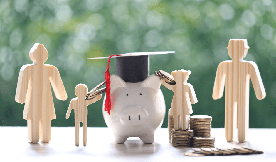 Piggy bank surrounded by figures, with a mortar board on top and money scattered around, symbolising the impact of the UK budget on schools.